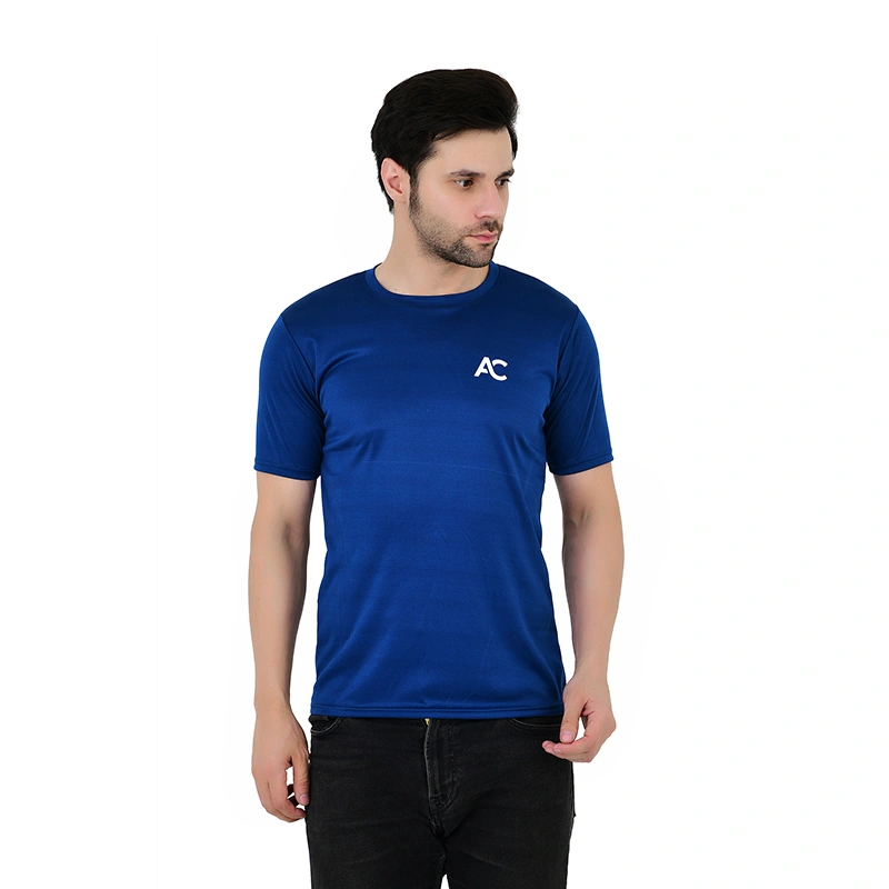 Male model in royal blue sports t-shirt with AC logo print and black jeans - menswear ecommerce photography by Lohar Studio Delhi